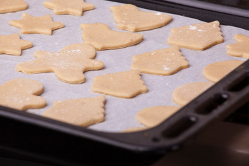 Fototapeta na wymiar a pan full of beautiful Christmas cookies ready to bake in the oven