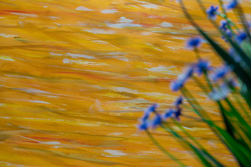 Yellow Color Paint Strokes on Canvas Surface, defocused Flowers.