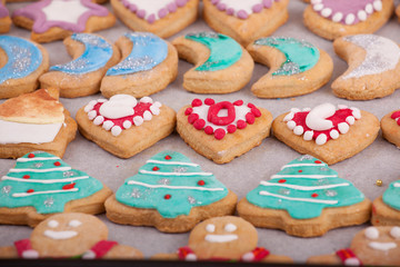 beautiful New Year and Christmas colorful cookies photographed on a wooden background