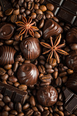 Assortment of white, dark, and milk chocolate. Chocolate with cream, nuts, almonds, hazelnuts and cinnamon with coffee beans. Sweet food and no diet concept.