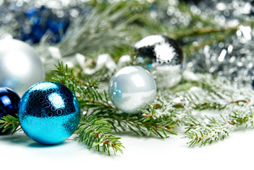 Fototapeta na wymiar Modern Christmas composition. Christmas balls, blue and silver decorations on white background. Flat lay, top view, copy space. close up photo. can be used us postcard or Christmas banner