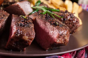 Fototapete Rund Slices of beef steak served with baked artichoke © Sławomir Fajer