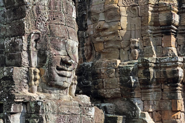 Ancient stone faces of Bayon temple in complex Angkor Wat in Siem Reap, Cambodia 
