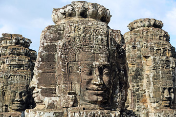 Fototapeta premium Ancient stone faces of Bayon temple in complex Angkor Wat in Siem Reap, Cambodia 