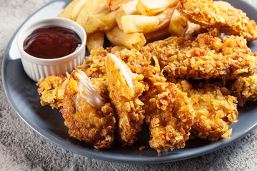 Chicken strips in cornflakes breadcrumb