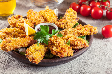 Chicken strips in cornflakes breadcrumb