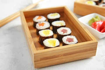 Tasty sushi on light table