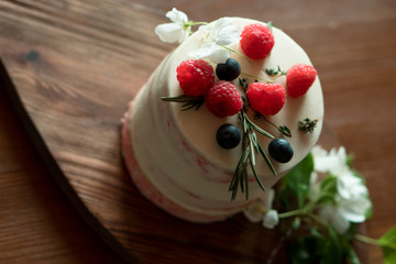 cake with strawberries on wooden table