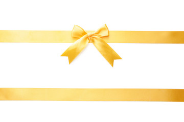 Golden ribbons with beautiful bow on white background