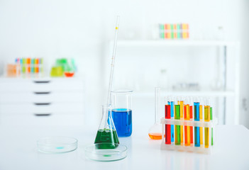 Glassware with colorful samples in laboratory