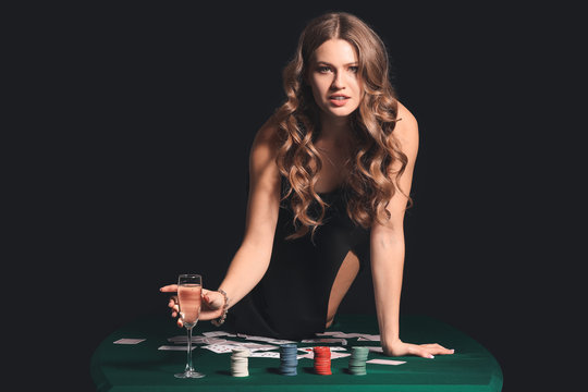 Female player sitting on table in casino