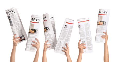 Female hands with newspapers on white background