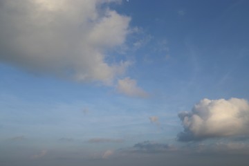 Naklejka na ściany i meble Sky blue and blue with clouds large and white