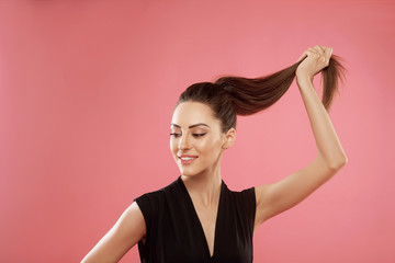 Portrait of woman with beautiful long hair. Beauty model girl with  brown straight long hair . Care and hair products