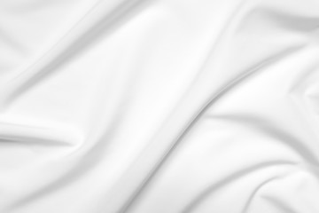 Fototapeta na wymiar Abstract white fabric texture background. Cloth soft wave. Creases of satin, silk, and cotton.