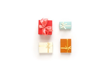 Red, turquoise, brown and white gift boxes set. Collection presents arranged on a white background, top view. Christmas, new year, birthday concept. Wedding invitation, greeting card for Mother's Day.