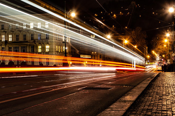 Fototapeta na wymiar Night traffic on road in city, urban speed transport lights