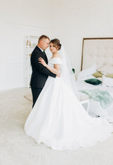 Naklejka premium Amazing couple hugging each other in the room