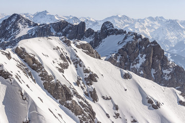 Fototapeta na wymiar High snowy mountain landscape peaks in winter covered in snow