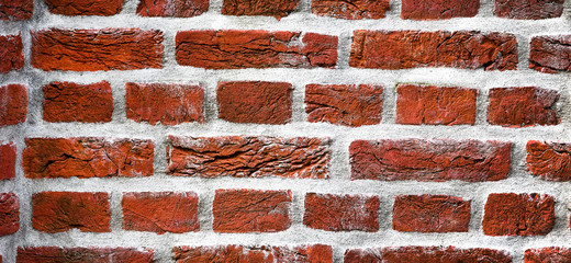 brick wall of red color, wide banner or panorama of masonry backround.