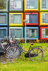 Fototapeta na wymiar Modern colorful architecture with bikes in Almere city, Netherlands