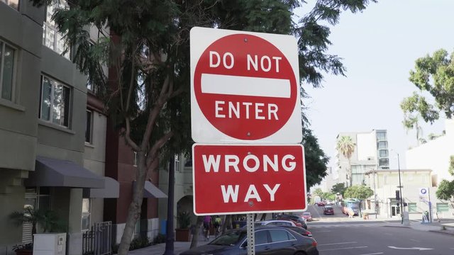 Wrong way do not enter sign. Located in San Diego downtown neighborhood 