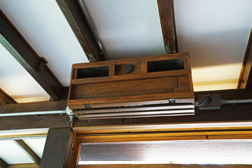 Wooden air conditioning box on ceiling