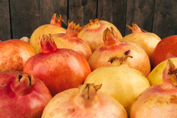 Group of pomegranate fruits close up background