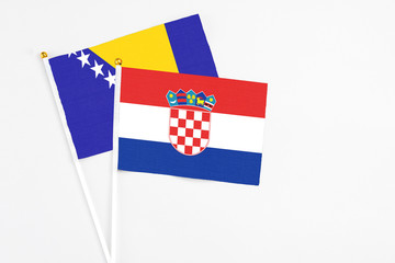 Croatia and Bosnia Herzegovina stick flags on white background. High quality fabric, miniature...