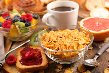 breakfast with cornflakes, coffee cup and fruits