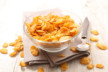 bowl of cereal, cornflakes and spoon