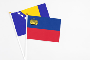Liechtenstein and Bosnia Herzegovina stick flags on white background. High quality fabric,...