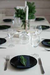 Table served for Christmas dinner in living room, close up view