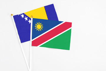 Namibia and Bosnia Herzegovina stick flags on white background. High quality fabric, miniature...