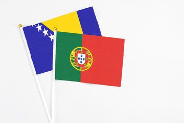 Portugal and Bosnia Herzegovina stick flags on white background. High quality fabric, miniature...