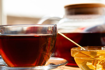 Close up of glass tea cup with honey