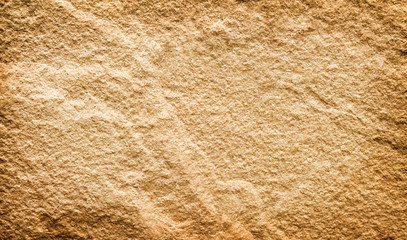 Sandstone surface natural rugged patterns brown background , copy space