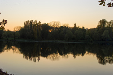 Fototapeta na wymiar Unusual sunset over the river in the fall.