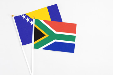 South Africa and Bosnia Herzegovina stick flags on white background. High quality fabric, miniature...