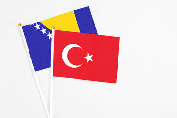 Turkey and Bosnia Herzegovina stick flags on white background. High quality fabric, miniature...