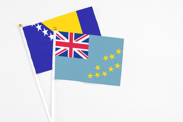 Tuvalu and Bosnia Herzegovina stick flags on white background. High quality fabric, miniature...