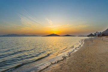 Sunset on the beach by the sea. La Manga del Mar Menor. Murcia, Spain