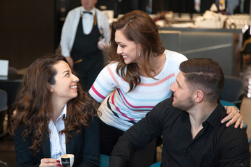 Young couple having fun at a caffe shop