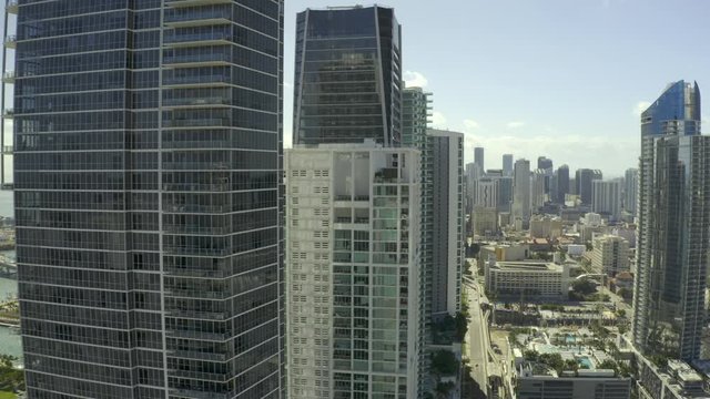 Aerial drone flying by Miami towers Downtown city landscape scene 4k