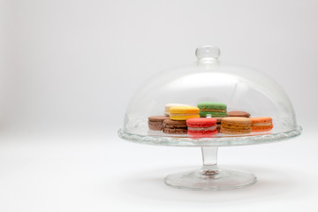 Traditional colorful french macarons on a serving stand.