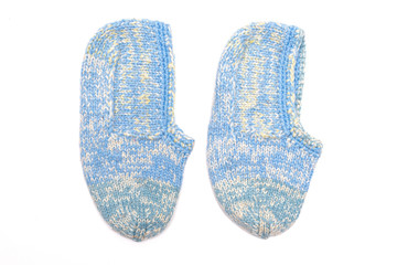 Woolen footsteps isolated on white background. Handmade knitwear.