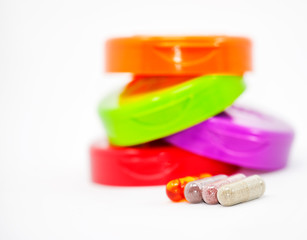 Fruit capsules vegetables and omegas with colored caps