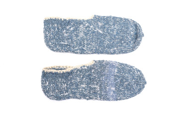 Woolen footsteps isolated on white background. Handmade knitwear.