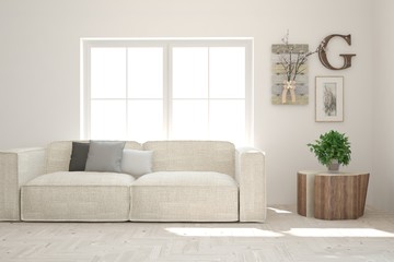 Stylish room in white color with sofa and pictures on a wall. Scandinavian interior design. 3D illustration