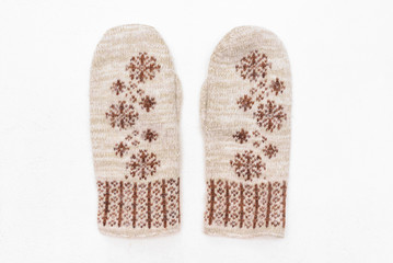 Woolen winter mittens isolated on white background.